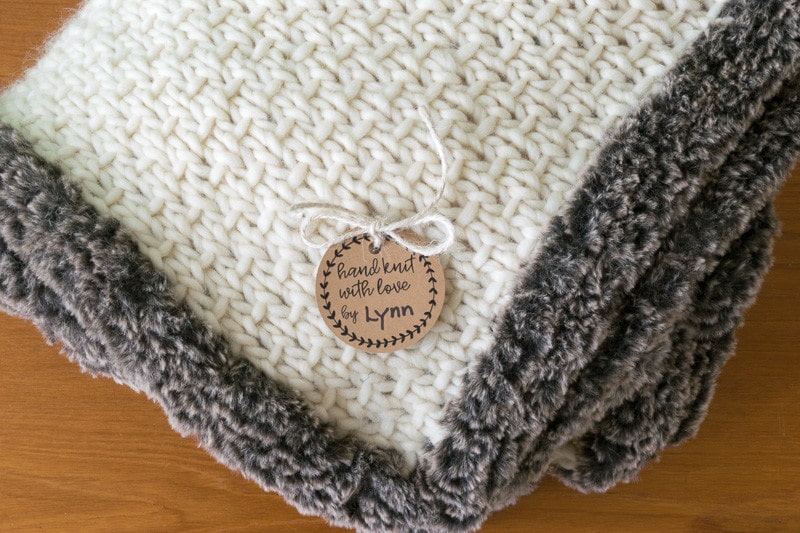 Half-linen stitch blanket with faux fur trim.
