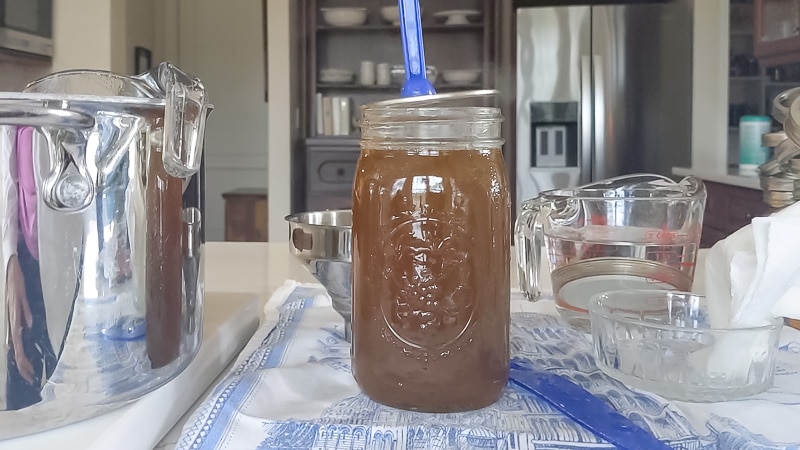 Putting Lid on jar while canning chicken stock