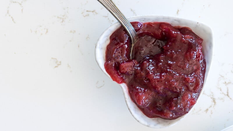 A heart-shaped bowl of plum jam.