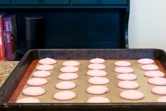 A silpat mat with macarons on it. One of the suggested eco-friendly products for a more sustainable kitchen.