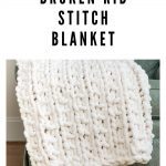 pin showing white chunky broken rib stitch blanket on green chair