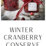 Jars of chunky cranberry jam or conserve with ribbon on the jar