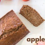 Cut loaf of apple spice bread with apples