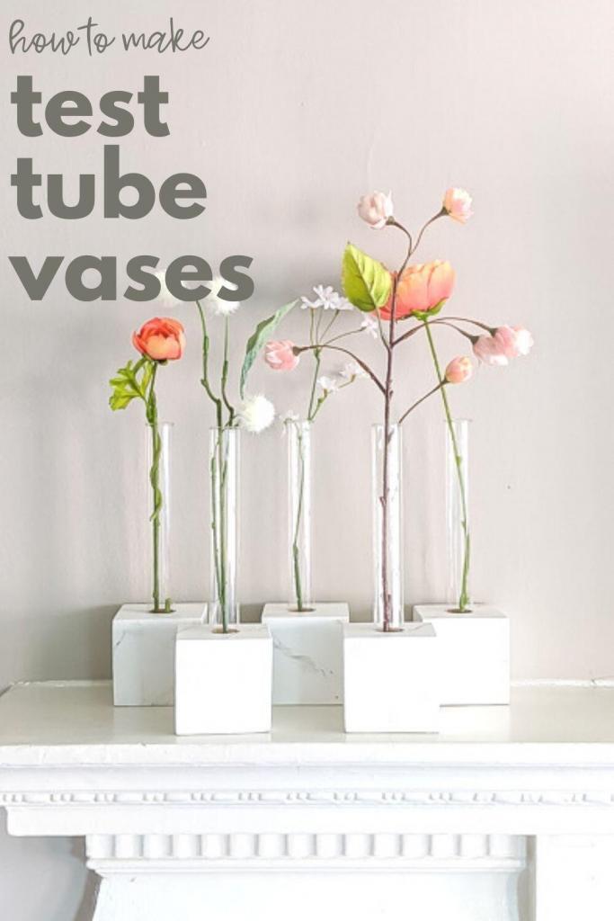 pin showing diy test tube vases with faux flowers on a mantel