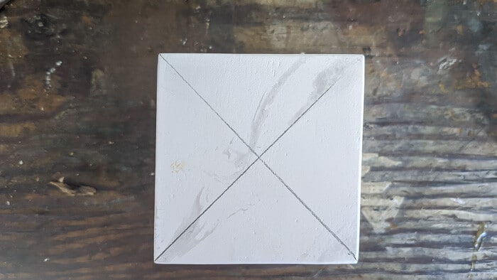 mark the center of your faux marble block with pencil