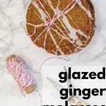 Stack of Glazed Ginger Molasses Crisps tied with red and white string