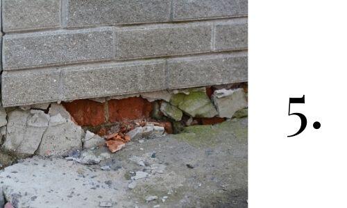 image shows crumbling foundation. installing pest prevention around crumbling foundation is a good home improvement task for November