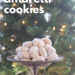 Amaretti cookies in silver footed bowl in front of the Christmas tree