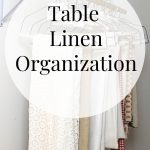 Organized Table Linens hanging in closet