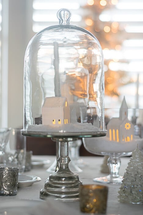 A little house in a cloche is part of the centerpiece on my Winter White Table Setting