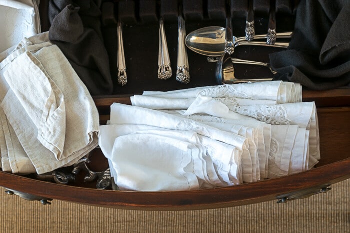 Napkins stuffed in drawers with silverware