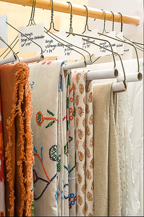 table linens on hangers.