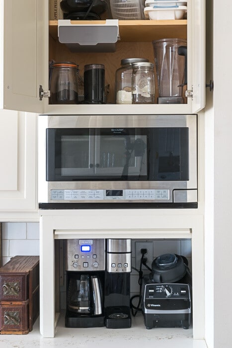 Create a Command Center specific to the use of that area is one of my kitchen organization tips. This is where we make coffee and smoothies, so I have gathered all the necessary supplies into this cabinet
