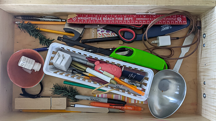 This was my kitchen drawer before I put in my simple drawer organization solution
