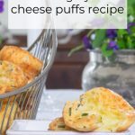 Chive and Gruyere Cheese Puffs in a Silver Basket with one cheese puff on a square plate..