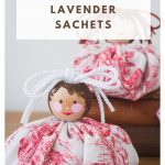 Two Lavender Sachets with fabric base and painted face.