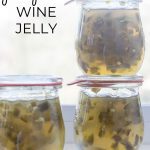 Three Jars of Jalapeno Wine Jelly in front of a window.