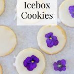 Lemon Icebox Cookies, some of which have fresh pansies on top.
