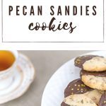 plate of pecan sandies cookies with cup of tea.