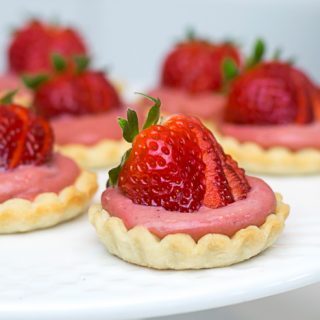 Mini strawberry tarts with curd and fresh strawberries.