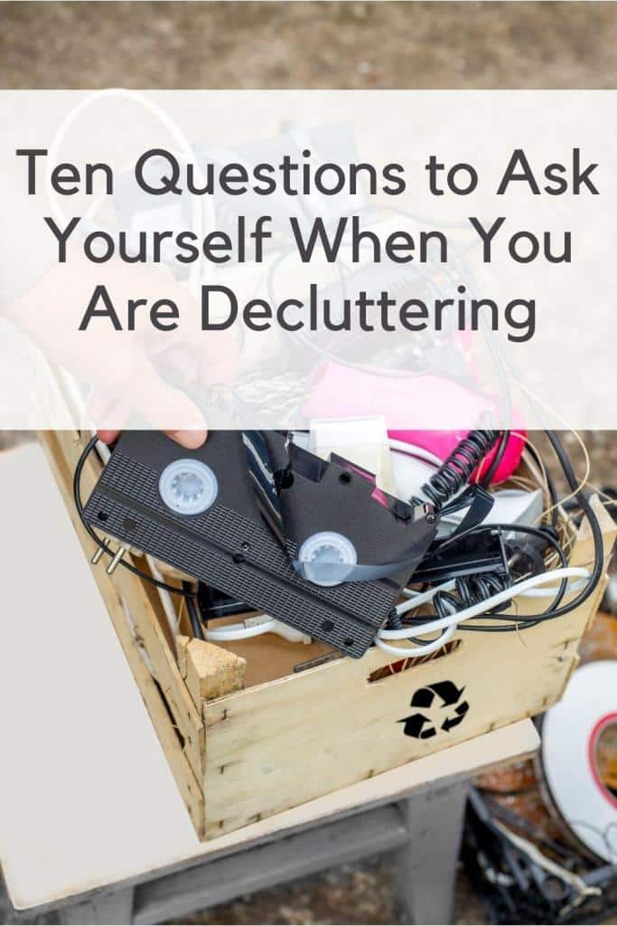 VCR Cassette, cords and other discarded items in a box.