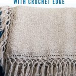 Beige Linen Stitch Trhow with Crochet Edge on blue sofa.