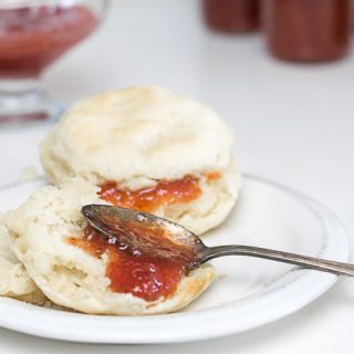 Strawberry Rhubarb Jam Recipe picture with a biscuit.