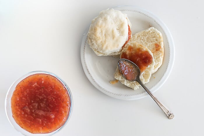 rhubarb and strawberry jam in a bowl and spread onto a biscuit.