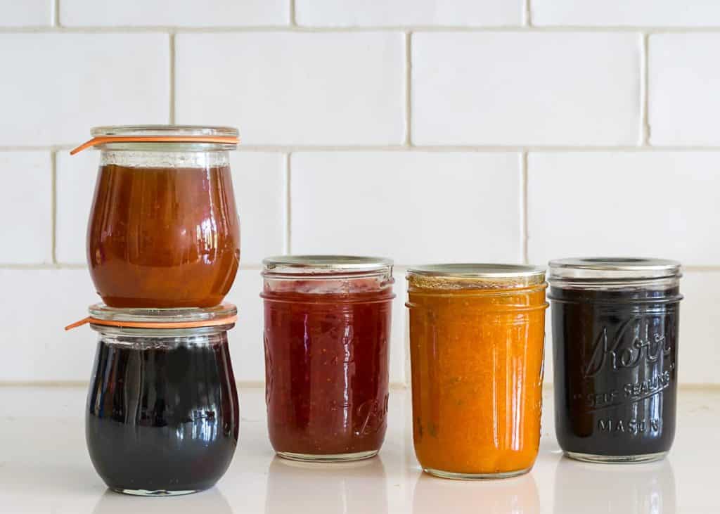 Five jars of jam or jelly