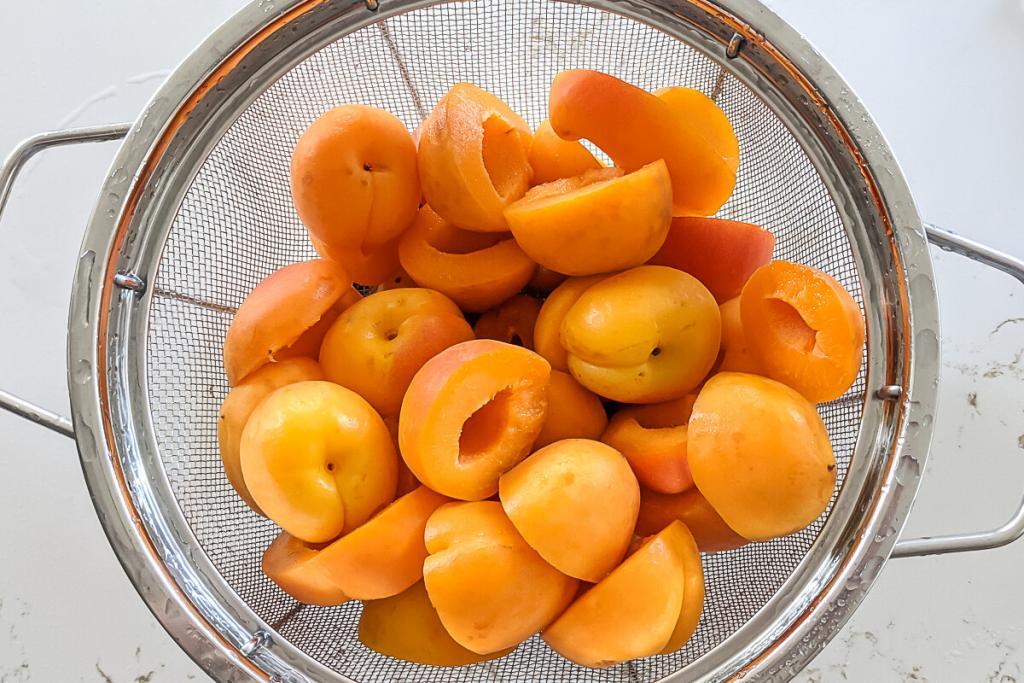 Fresh apricots, cut and pitted.