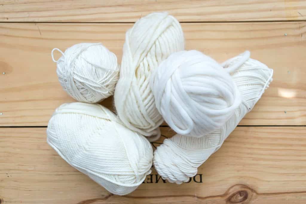 Balls of white yarn for knitting.