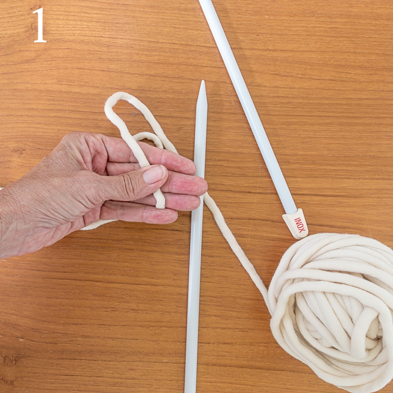 Holding yarn between thumb and fingers on left hand to form slip knot.