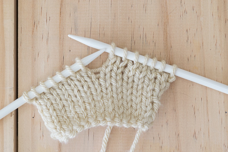 Image of knit work on needles; when you see this, how do you know in which direction you should knit?