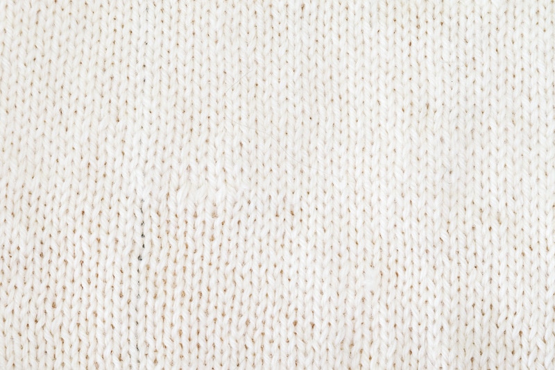 A swatch of knitted fabric showing a section of the work where yarn was joined using the Russian Join.