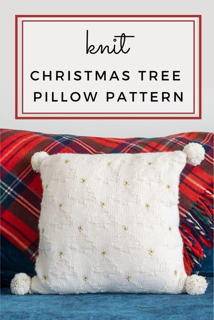 White Knit pillow against a red plaid blanket.