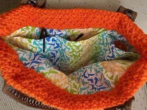 Inside of orange knit purse.