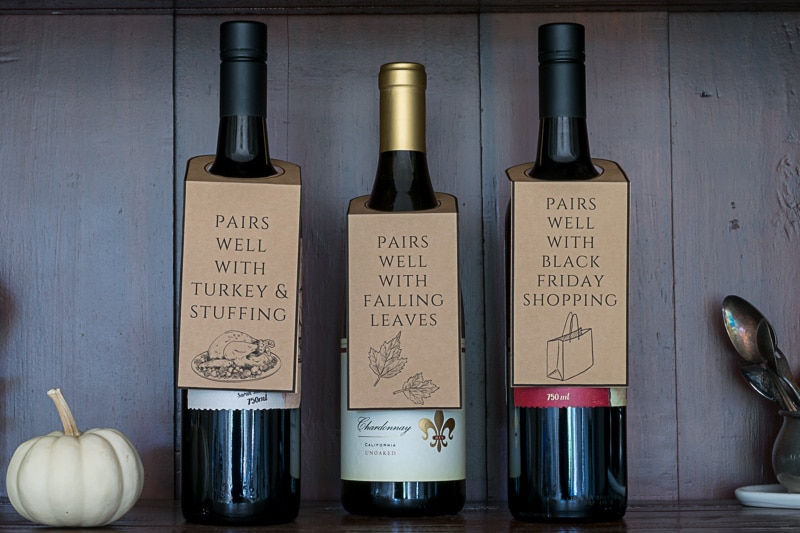 Three bottles of wine with wine tags.