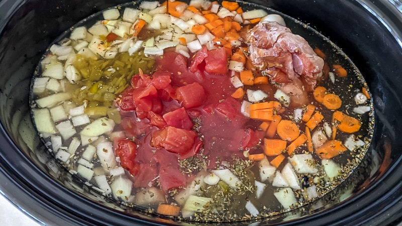 Soup ingredients in a slow cooker crock.