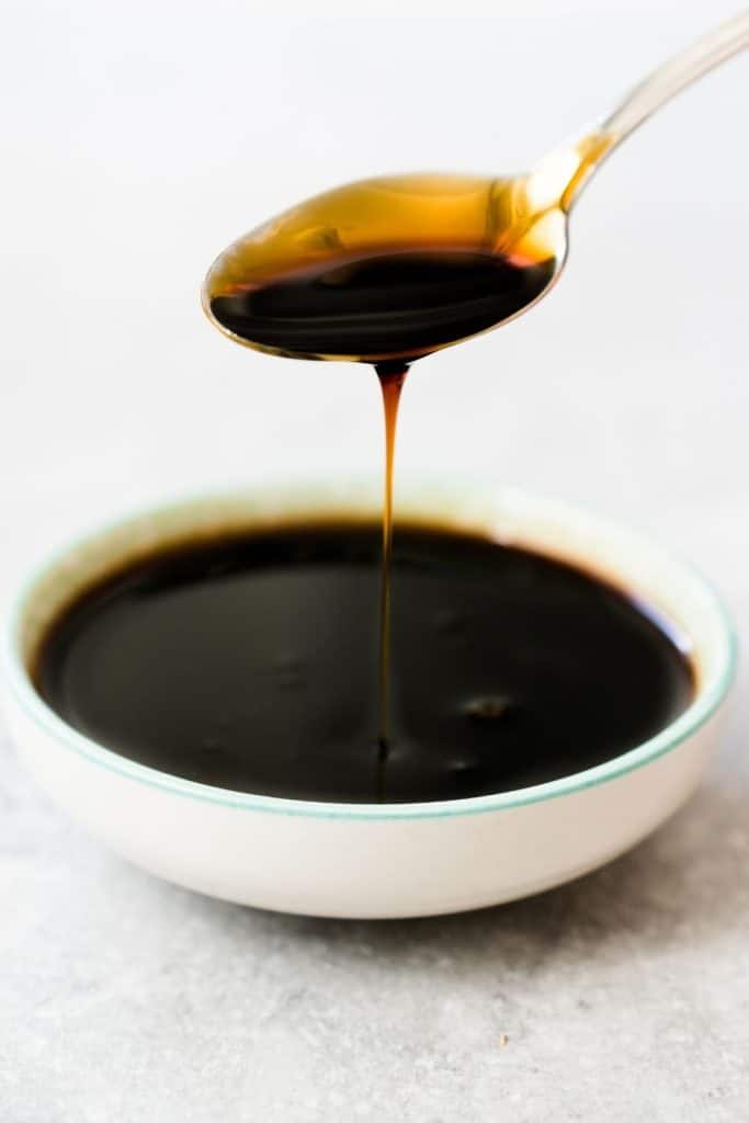 molasses dripping into a bowl.
