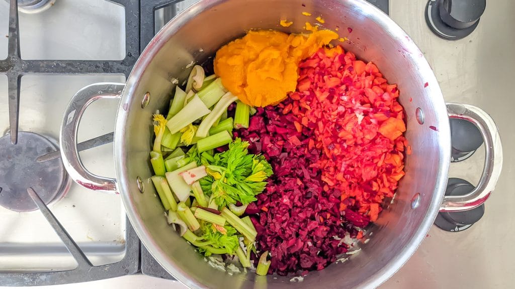 Nomato Sauce Ingredients in a stock pot.