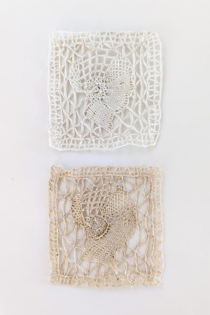 Two pieces of lace, one clean and one stained with age.