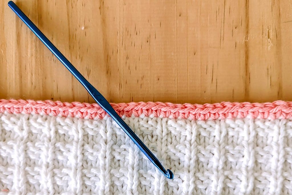 add crochet edge to knit piece.