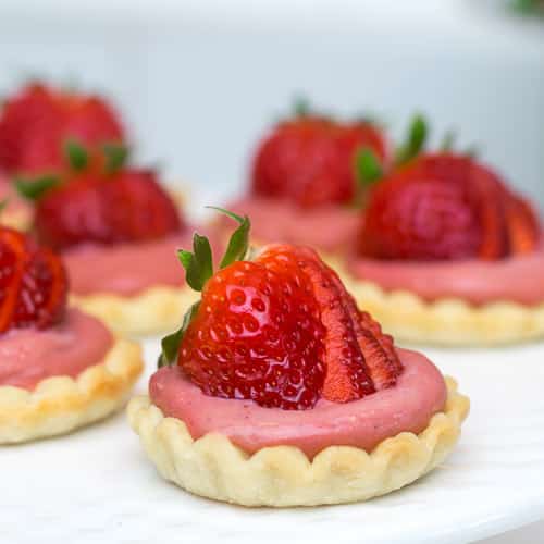 mini strawberry curd tarts.