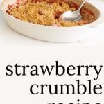 Strawberry Crumble in a baking pan with a bowl of crumble in front.