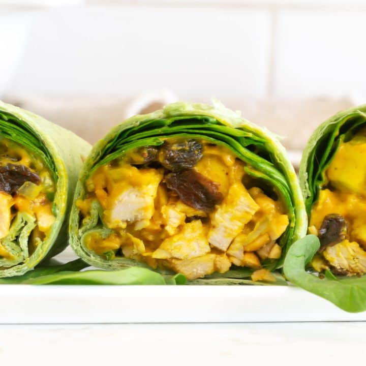 Curried chicken salad wraps in a row