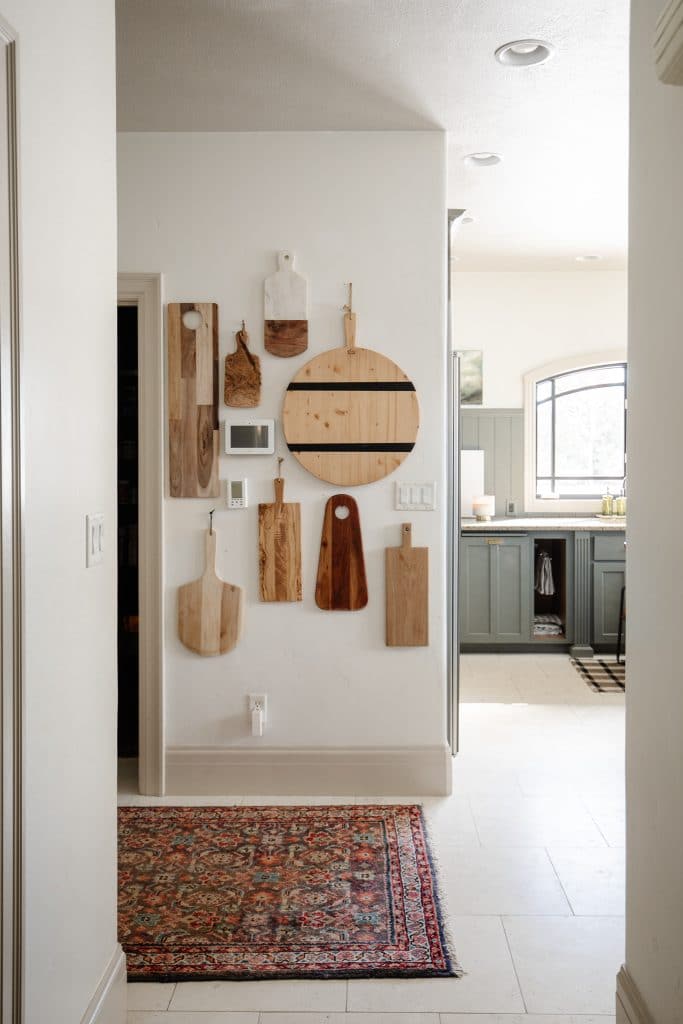 Display cutting boards hanging on a wall.