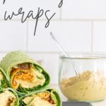 Hummus wraps with a jar of hummus in the background.