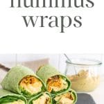 Hummus wraps with a jar of hummus in the background.