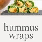 Hummus wraps with a bowl of fruit in the background.