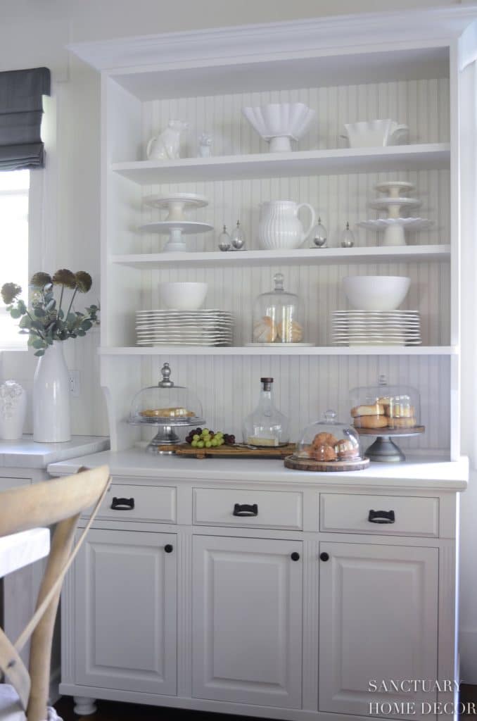 White hutch with white dishes